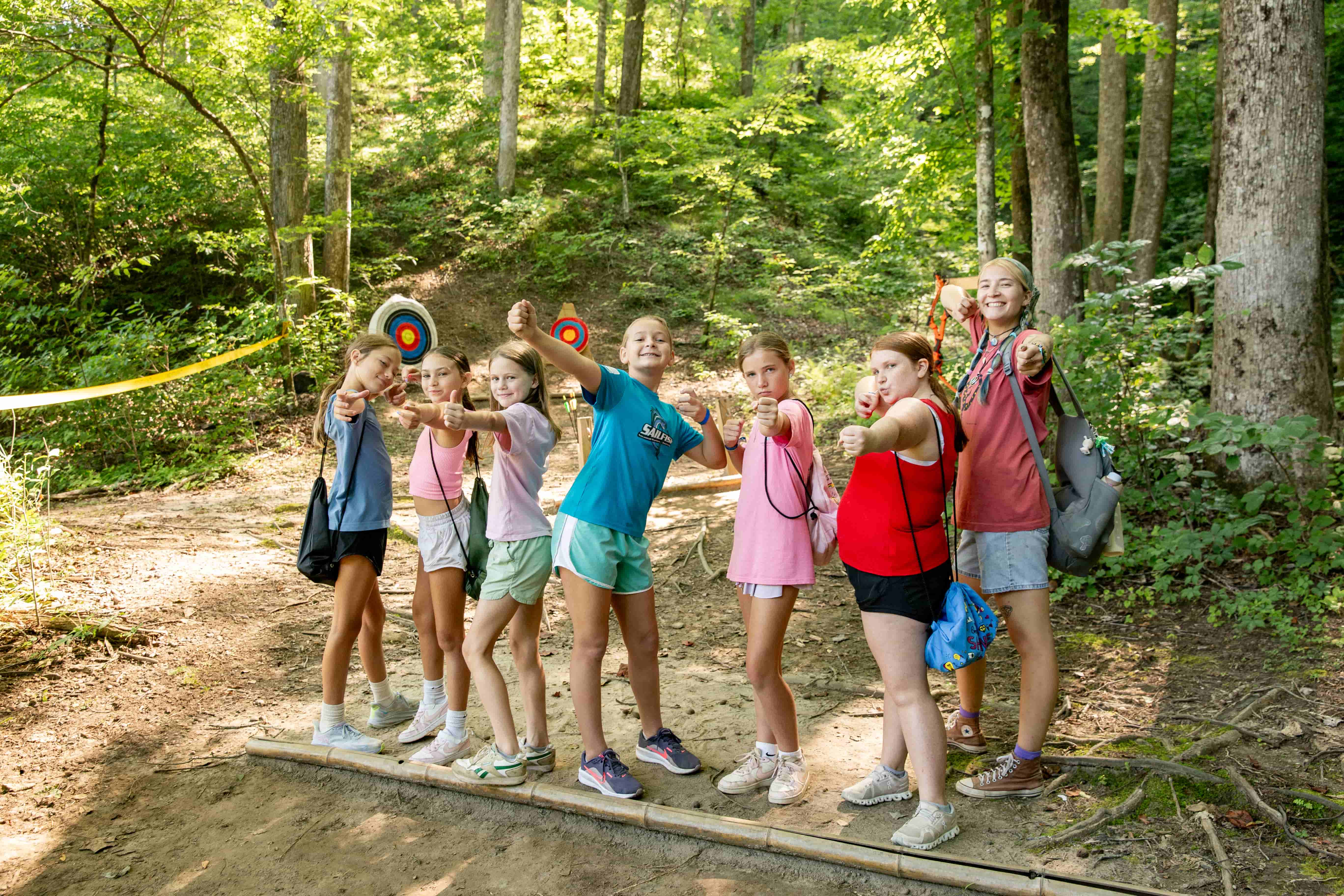 Girls posing at archery class